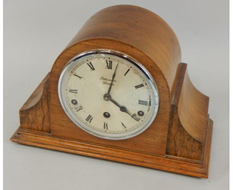 A mid 20thC mantel clock, in a walnut case, the silvered dial signed J W Benson of London, 30cm wide