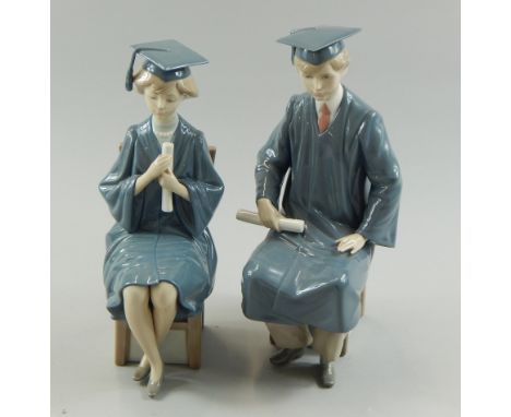 A pair of Lladro porcelain figures, each modelled as students wearing gowns and mortar boards, seated on a chair, the largest
