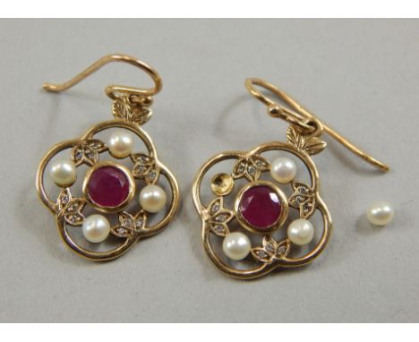 A pair of 9ct gold garnet and seed pearl earrings, the drop design with leaves, one seed pearl loose, 3.7g all in.