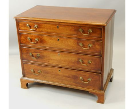 A George III mahogany chest of drawers, the rectangular top with a moulded edge, above four graduated drawers, with brass dro