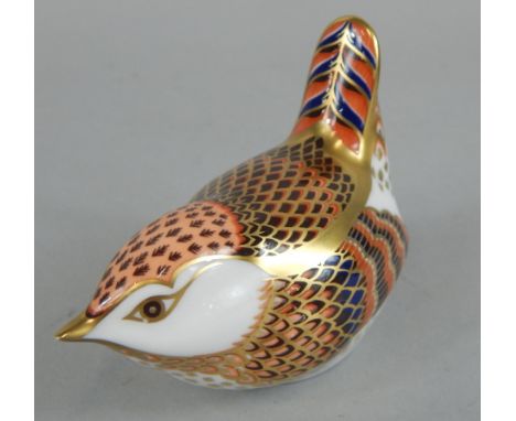 A Royal Crown Derby porcelain bird, printed mark in red to underside and silver button