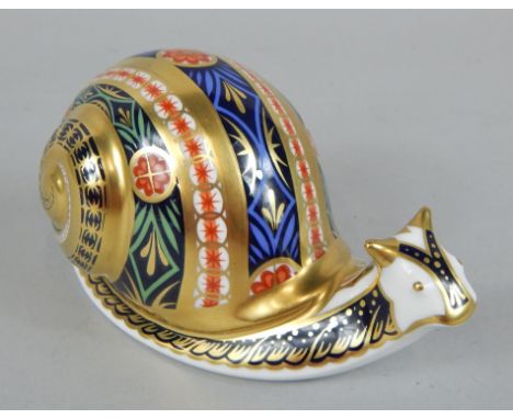 A Royal Crown Derby Imari pattern garden snail, limited edition number 2980/4500, gold button to underside, signature of John