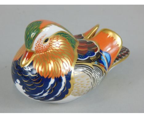 A Royal Crown Derby porcelain duck, printed mark in red to underside and silver button