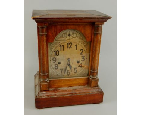 A late 19th/early 20thC secessionist style Continental mantel clock, the dial engraved with roundels etC, (AF and incomplete)