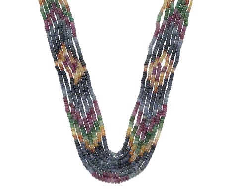 with graduating faceted groups of emerald, ruby, blue, yellow and orange sapphire beads, in graduating tones, to multi-colour