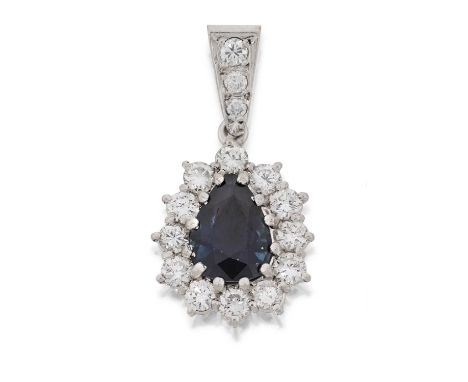 the pear shaped sapphire within a border of round brilliant cut diamonds, in white claw settings, suspended from a round bril
