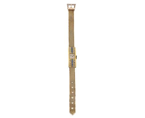 manual wound lever movement, silvered dial with Arabic numerals, the yellow geometric design bezel enamelled in red, blue and