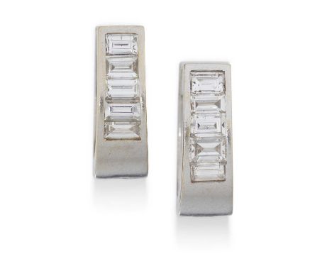 white channel set baguette cut diamonds to a hinged plain polished back, total estimated diamond weight 0.80 carat approximat