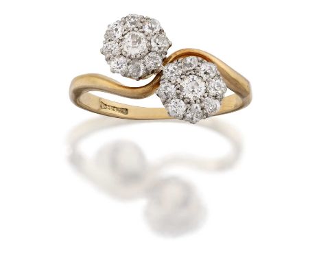 the clusters comprising of an old cut diamond within a border of smaller old cut diamonds, in white claw settings, to a yello