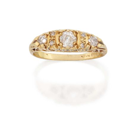 the graduated old cut diamonds, with eight-cut diamond accents, in yellow claw settings, with a scroll gallery, to a plain po