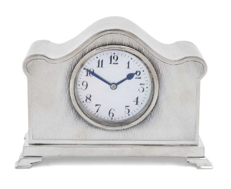 oblong and with an arched top, the front engine-turned on four stepped block feet, the mother-of-pearl dial with Arabic numer