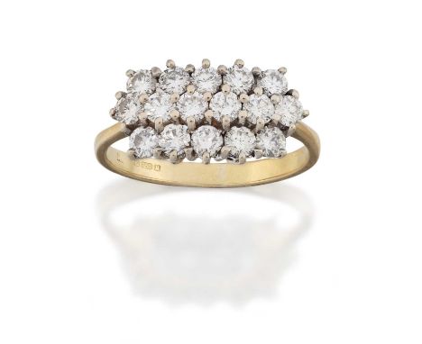 comprising of three rows of round brilliant cut diamonds, in white claw settings, to a yellow tapered shoulder plain polished