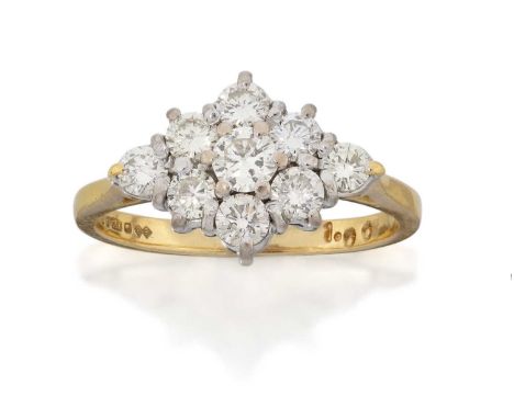 the lozenge shaped cluster set throughout with round brilliant cut diamonds, in white claw settings, to a yellow tapered shou