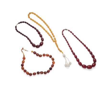  A collection of beaded necklaces  Including two amber bead necklaces and two Bakelite bead necklaces (4)   Proceeds from the