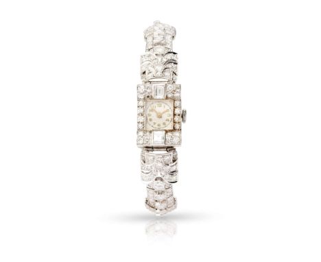  A diamond cocktail watch, circa 1920s  The rectangular dial with Arabic numerals, the rectangular bezel pavé-set with gradua