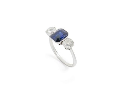  A sapphire and diamond three-stone ring  Millegrain-set with a rectangular step-cut sapphire and two old round-cut diamonds,
