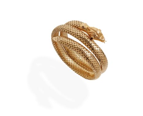  A coiled snake bangle  Modelled as a coiled snake, the steel sprung tubo-flex body terminating in an engraved tail and head,