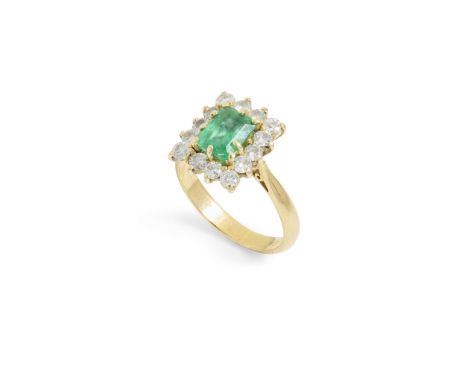  An 18ct gold emerald and diamond cluster ring  Claw-set with a step-cut emerald, in a border of round brilliant-cut diamonds