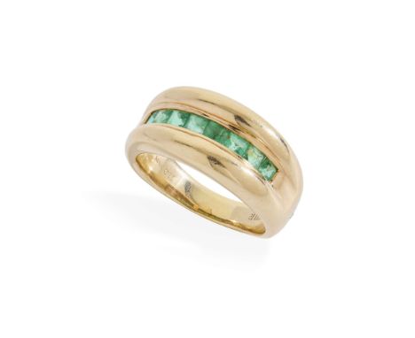  An emerald dress ring  Channel-set with eight square step-cut emeralds, one shoulder gypsy-set with a small round brilliant-
