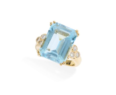  A blue topaz and diamond cocktail ring  Claw-set with a rectangular step-cut blue topaz, each shoulder set with three round 