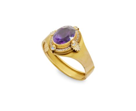  A mid-19th century amethyst and enamel bangle, circa 1870  Of hinged design, collet-set with a large foil-backed oval-cut am