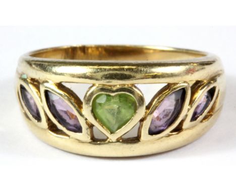 A 9ct yellow gold amethyst and peridot set ring, (L.5).