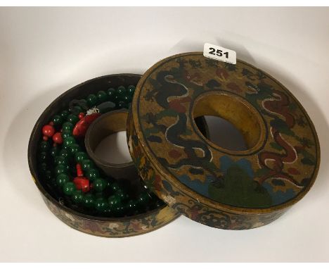 A large strand of Tibetan green jade and other stone prayer beads with circular hand painted storage box, folded L. 95cm.