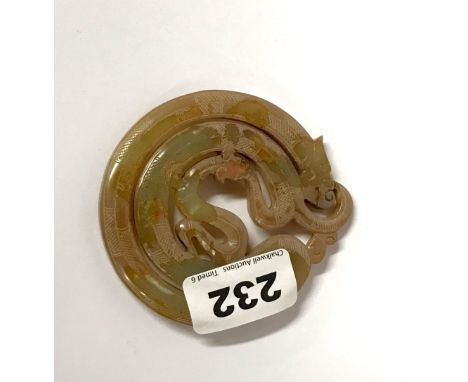 A fine Chinese archaic form carved jade amulet of a coiled dragon with a young dragon chasing his tail. D.8cms