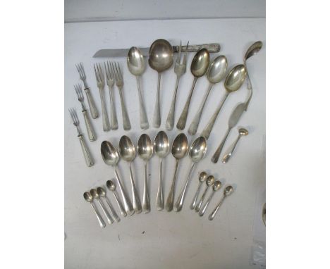 An early 20th century Dutch white metal set of cutlery to include a carving fork and knife, table spoons, coffee spoons and o