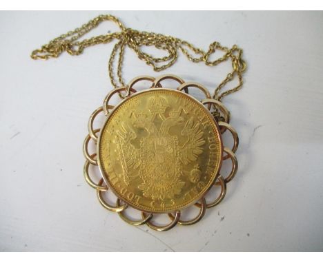 An Austrian four Ducal gold re-strike coin, in a gold coloured metal surround, on a fine chain, 27.5g 