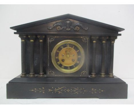 A late 19th century French Samuel Marti black marble cased mantle clock.  The architectural case having Corinthian columns fl