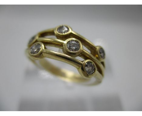 An 18ct yellow gold ring, the upper section fashioned as three bands, each set with two diamonds, size K/L, 4g 