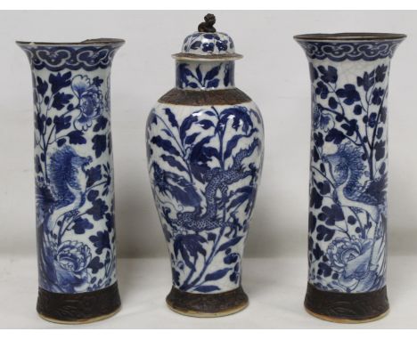 Chinese crackle glaze blue and white vase of baluster form decorated with scrolling dragons amongst foliage with brown glazed