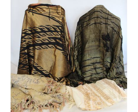 Eastern brocade shawl woven with black, metallic gold and red threads, with fringing to borders, approx. 140cm x 125cm; anoth