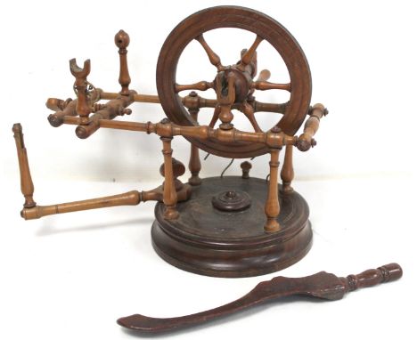 Early 19th century treen bobbin winder with spoked wheel on circular plinth base, 25cm high; also a treen knitting stick with