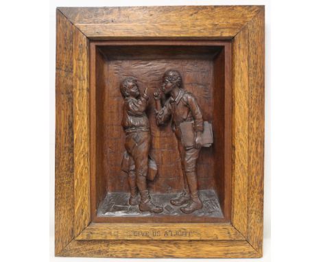 19th or early 20th century deep relief carved wooden panel depicting two boys smoking, entitled "Give us a light", contained 