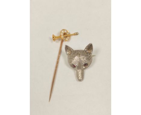 Gold scarf pin with hunting horn and pearl set horseshoe, 'SS 18' and a Victorian&nbsp; silver fox head brooch, with glass ey
