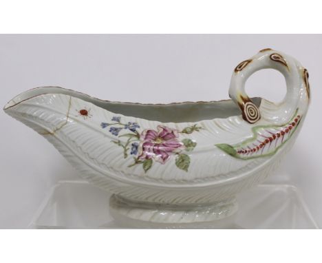 18th century English porcelain cos lettuce leaf moulded sauce boat with naturalistic branch scroll handle, moulded leaves and