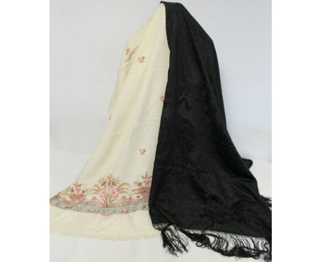 Cream wool shawl with chain stitch floral decoration in pink and green, approx. 184cm x 60cm; a black silk brocade fringed pi