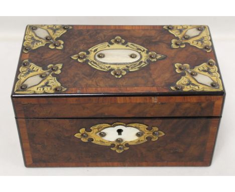 Victorian burr walnut tea caddy of rectangular form with crossbanded borders and applied brass and ivory panels, the interior
