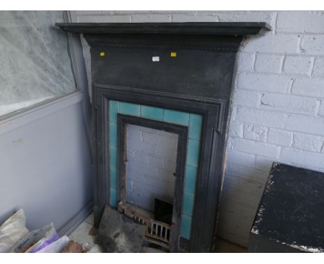Metal fire surround with green tile inlay
