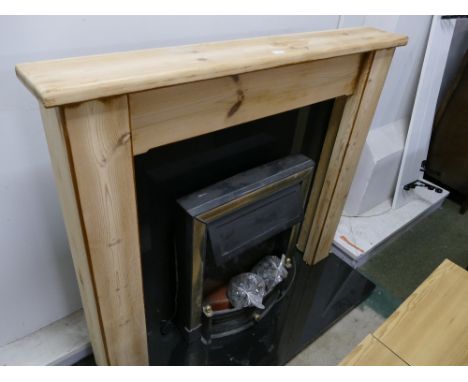 Modern electric fire with pine surround