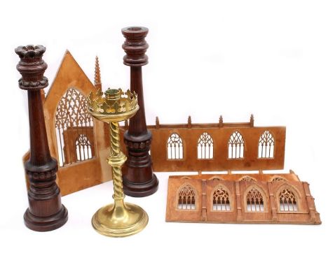 Two early 20th Century church wooden candlesticks, along with brass stick and a model of a church