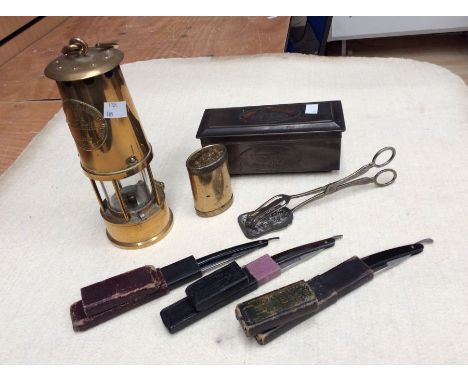 Brass vintage miners lamp, cut throat razors, metal box, tea and sugar box, cake tongues etc