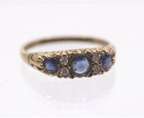 A sapphire and diamond 9ct gold ring, comprising three round cut sapphires, intersected with diamonds accents, size N, total 