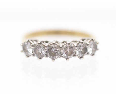 A six stone diamond  and 18ct gold ring, comprising claw set round brilliant cut diamonds, total diamond weight approx 0.90ct