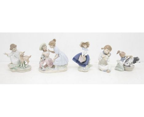 Three Lladro figures, two boxed along with two Nao figures