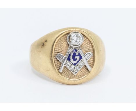 A yellow metal and diamond Masonic ring, the square set with eight-cut diamonds, the compasses surmounted with a round brilli