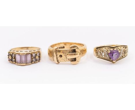 A 9ct gold buckle ring, width approx 7mm, size S, two other 9ct gold dress rings both set with amethyst, sizes N and O, combi