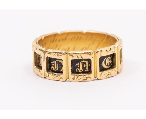 A Victorian 18ct gold and enamel morning ring, comprising gold cartouche with engraved decoration, inset with black enamel an